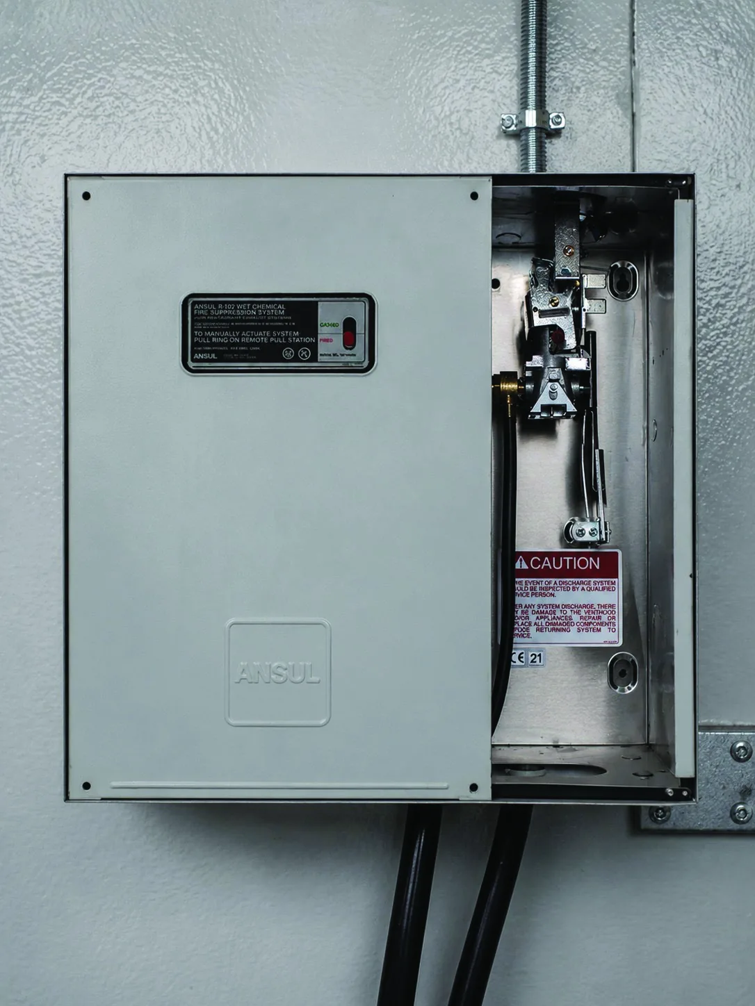 Fire suppression control cabinet opened for scheduled preventive maintenance